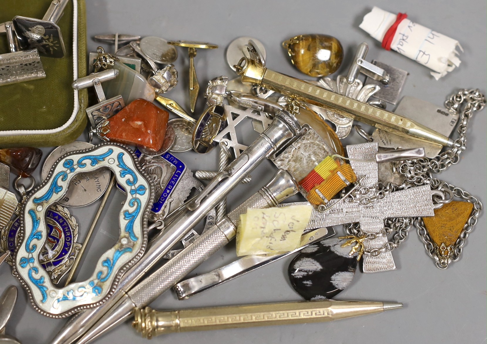 A group of mixed items including quartz pendants, a sterling and enamel brooch, 68mm, assorted pairs of cufflinks, medallions and four pens including Sampson Mordan, hallmarked for London, 1932.